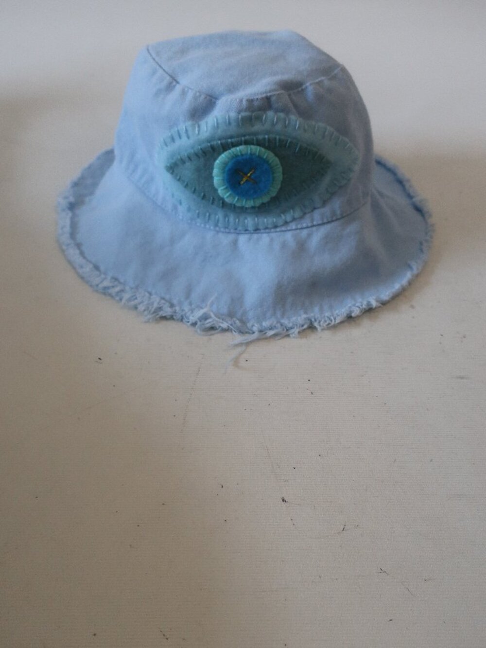 NWT Womens Romi Basha Baby Blue Canvas Bucket Hat W/Evil Eye